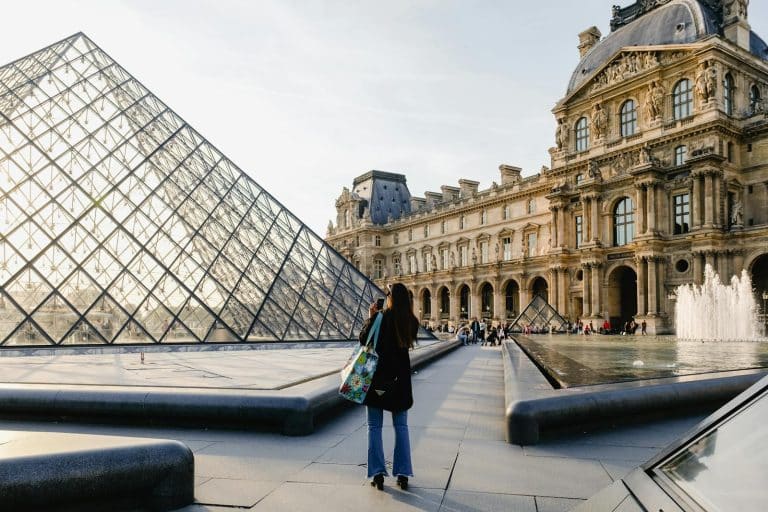 Woman Taking Photo Of Building